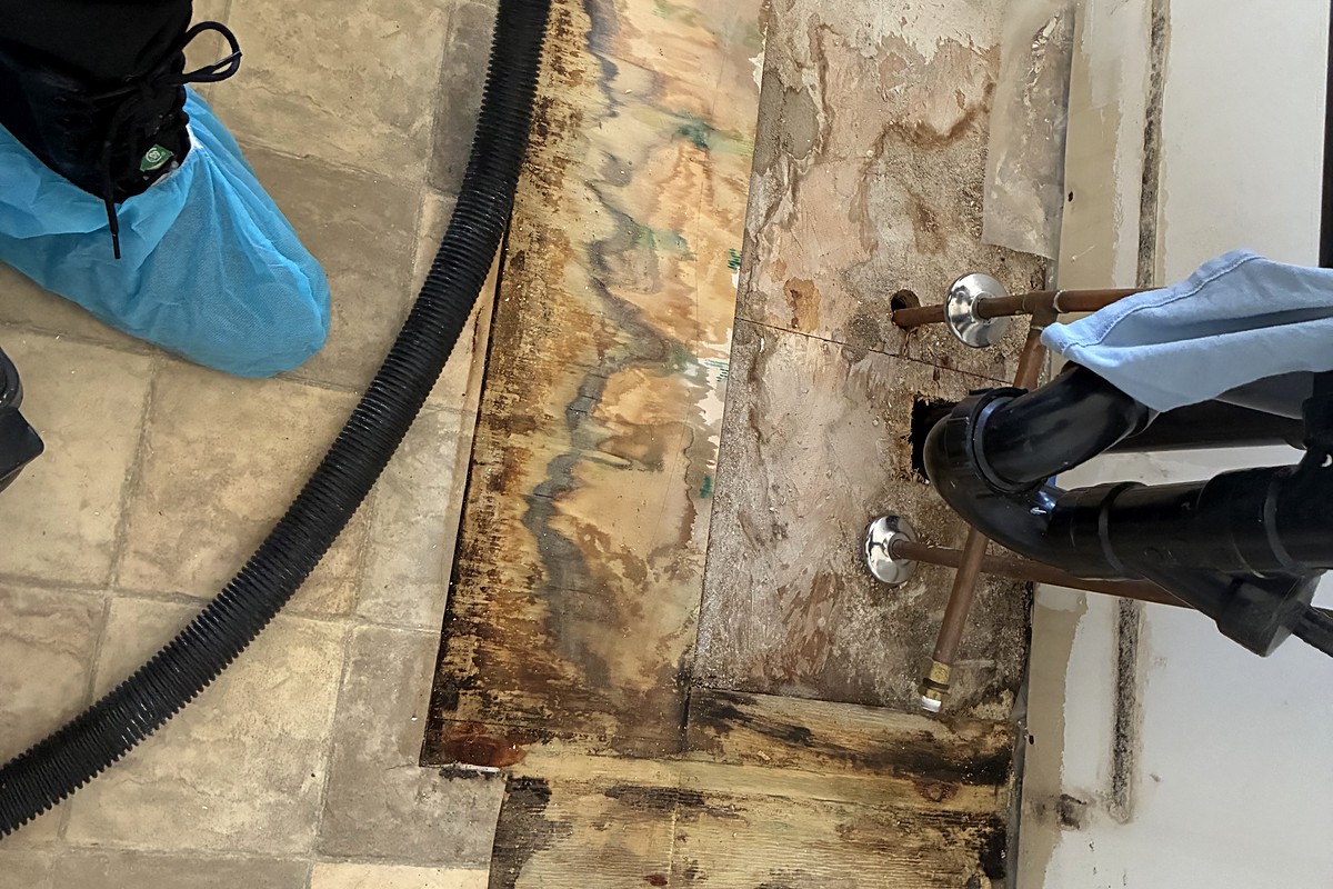 HEPA vacuuming a subfloor